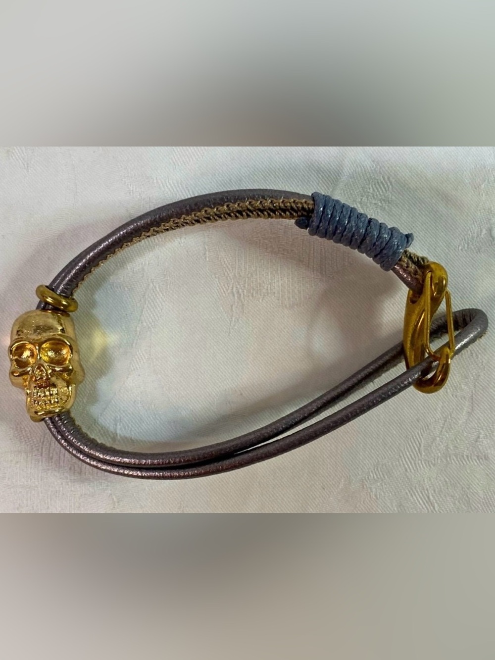 Minimalist Grey Leather Wrap Bracelet with Polished Gold-Tone Skull Charm